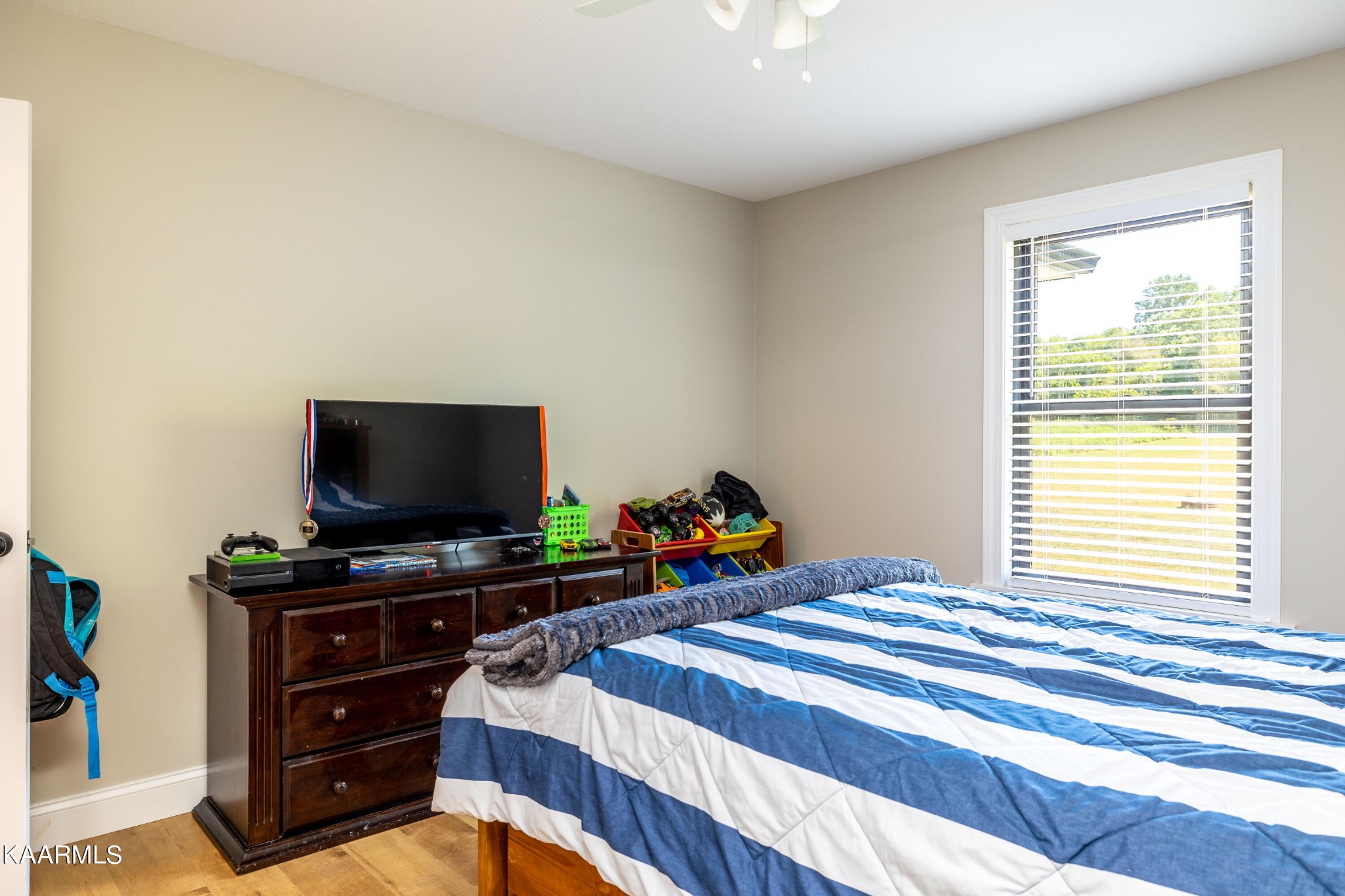 4385 Niles Ferry Road Greenback, TN 37742 - Photo 30 of 51 a bedroom with a bed and a flat screen tv