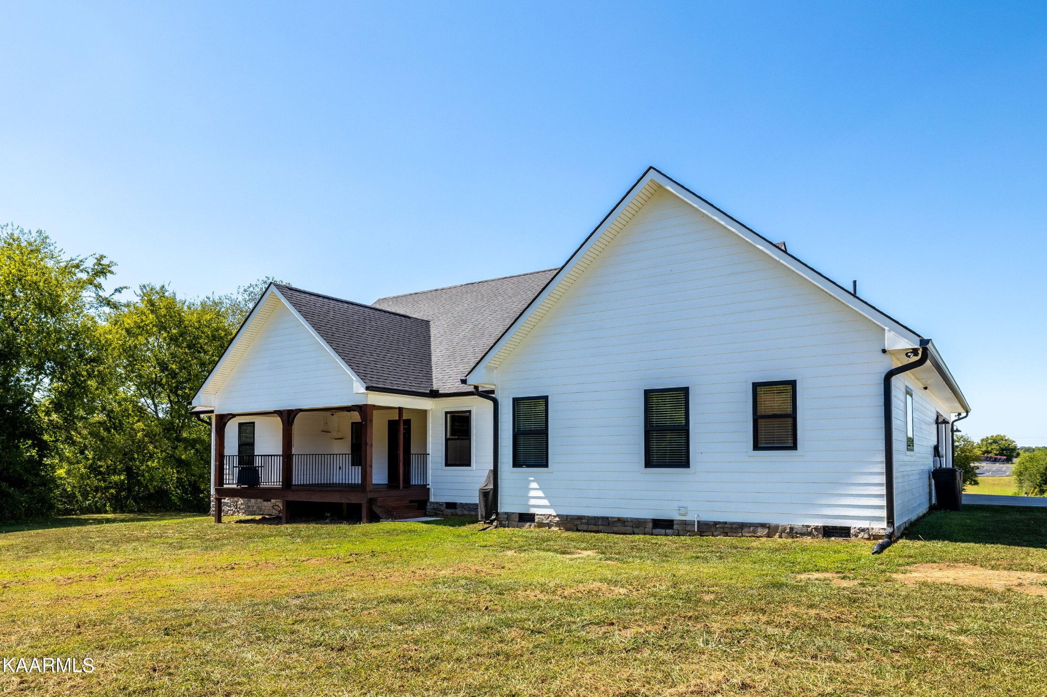 4385 Niles Ferry Road Greenback, TN 37742 - Photo 39 of 51 a view of a house with swimming pool in front of it