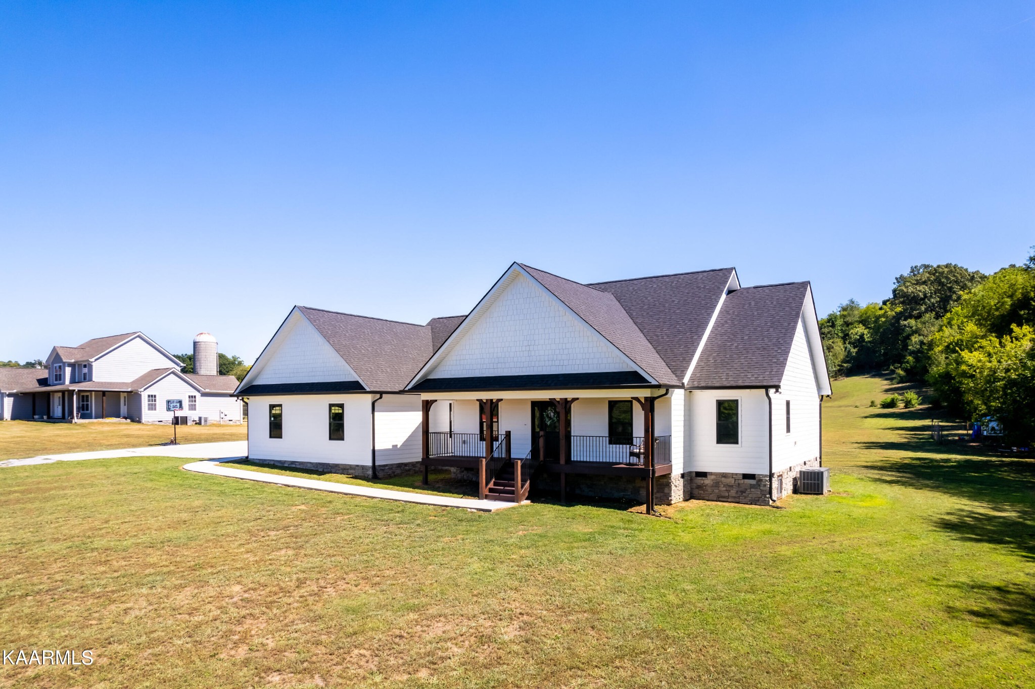 4385 Niles Ferry Road Greenback, TN 37742 - Photo 43 of 51 a front view of a house with a yard table and chairs