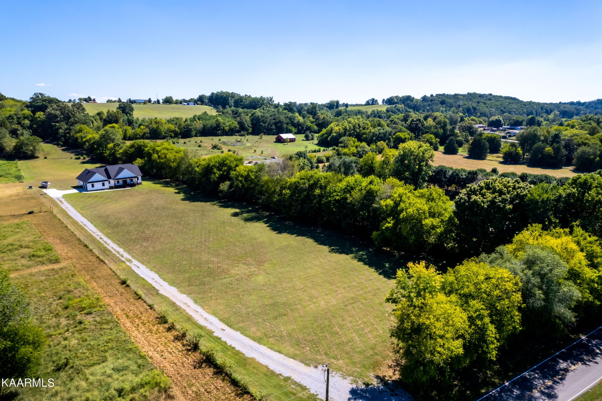 4385 Niles Ferry Road Greenback, TN 37742 - Photo 50 of 51 a view of a lake with a mountain in the background