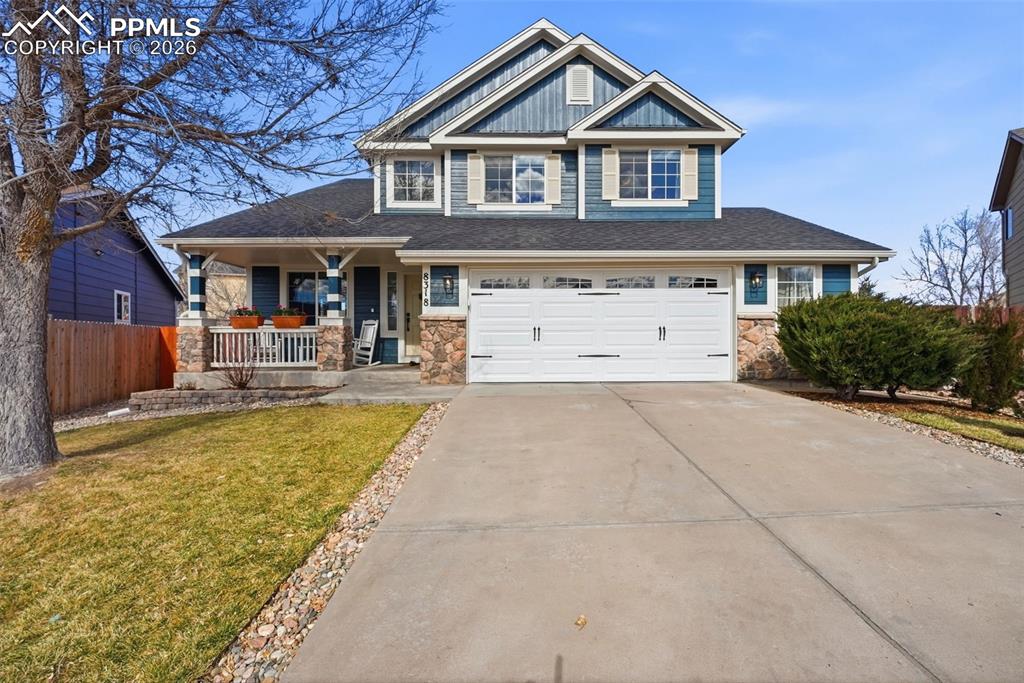 8318 Shadow Run Lane Fountain, CO 80817 - Photo 1 of 50 a front view of a house with garden