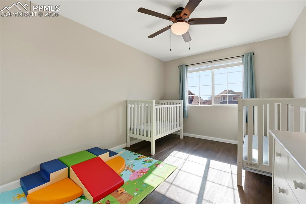 8318 Shadow Run Lane Fountain, CO 80817 - Photo 26 of 50 a bedroom with a bed and a window
