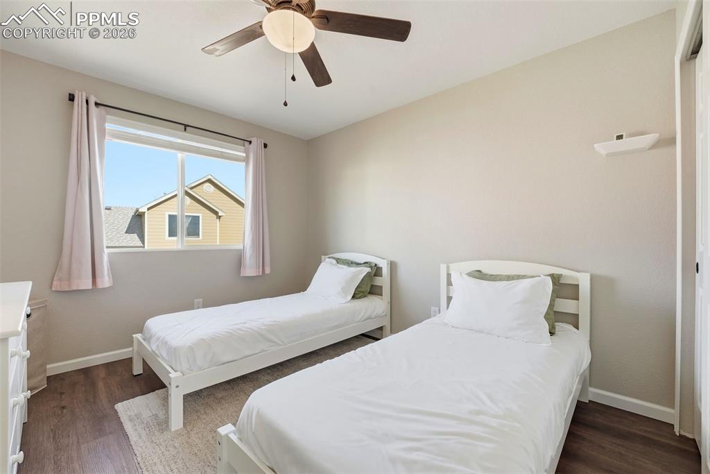 8318 Shadow Run Lane Fountain, CO 80817 - Photo 29 of 50 a bedroom with two beds and a window
