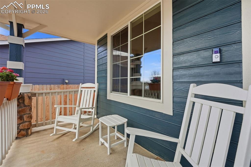 8318 Shadow Run Lane Fountain, CO 80817 - Photo 3 of 50 a view of deck with table and chairs and wooden floor