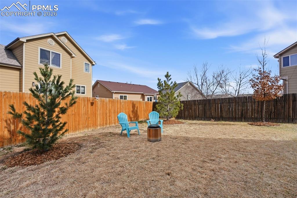 8318 Shadow Run Lane Fountain, CO 80817 - Photo 36 of 50 a backyard of a house with seating space