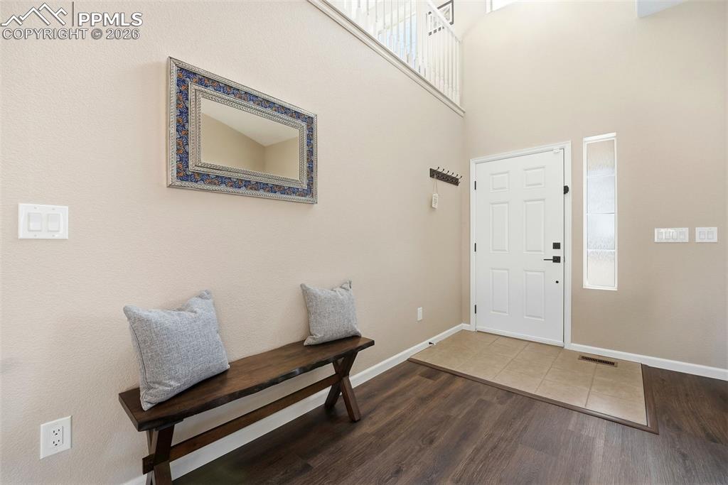 8318 Shadow Run Lane Fountain, CO 80817 - Photo 4 of 50 a view of a room with wooden floor and windows