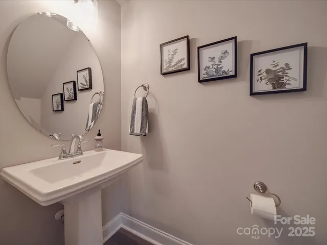a bathroom with a sink and mirror