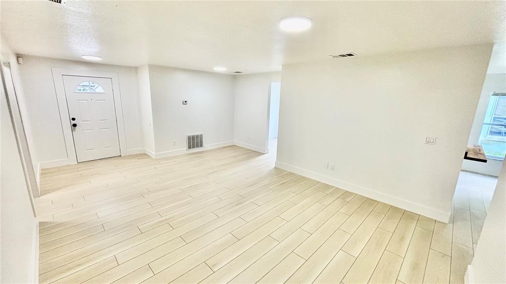 712 19th Street Orlando, FL 32805 - Photo 16 of 28 a view of empty room with wooden floor