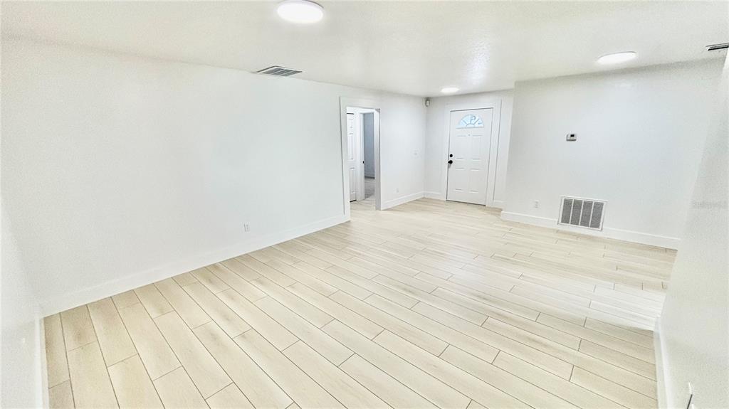 712 19th Street Orlando, FL 32805 - Photo 17 of 28 a view of empty room with wooden floor