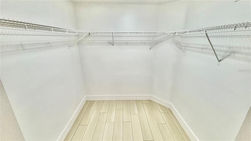 712 19th Street Orlando, FL 32805 - Photo 21 of 28 a small walk in closet with a shower
