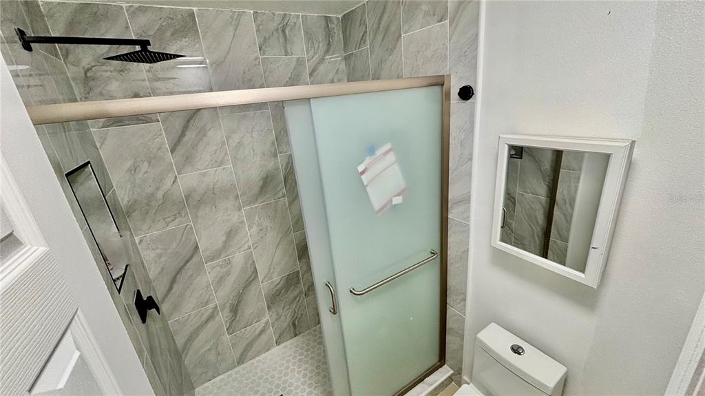 712 19th Street Orlando, FL 32805 - Photo 27 of 28 a bathroom with a shower