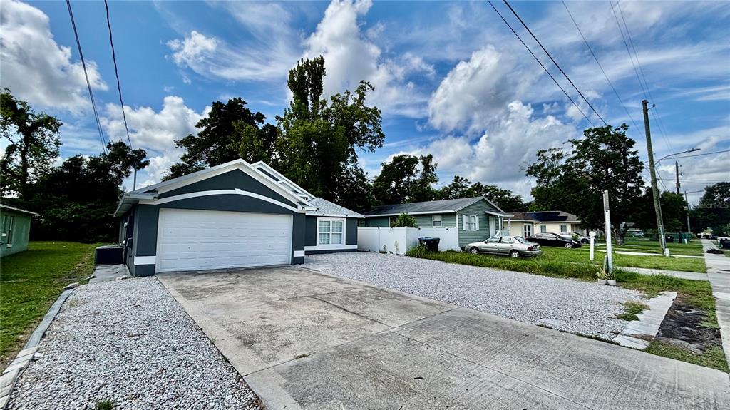 712 19th Street Orlando, FL 32805 - Photo 4 of 28 a view of an house with a yard and potted plants