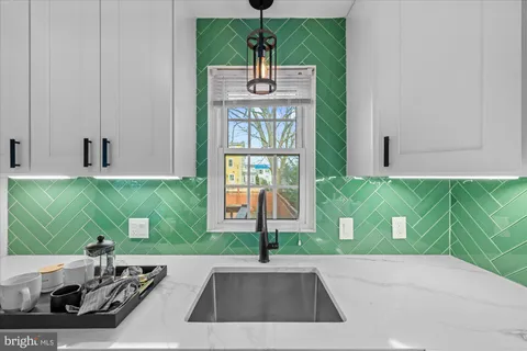 a living room with a table and a potted plant