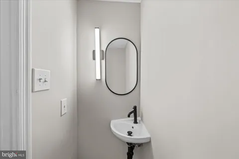 a spacious bedroom with a bed and glass window