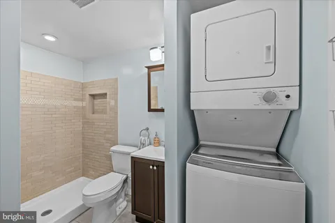 a bathroom with a shower and a sink