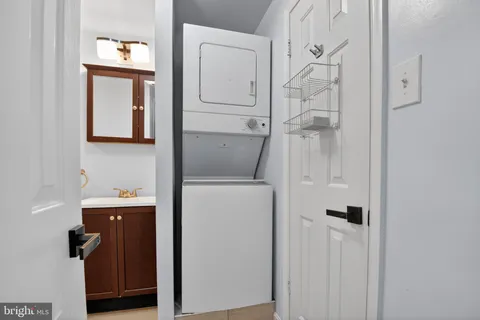 a living room with furniture and a lamp