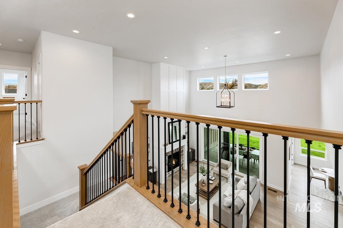 6774 Saddle Bred Way Star, ID 83669 - Photo 21 of 41 Corridor featuring plenty of natural light, recessed lighting, a chandelier, and an upstairs landing