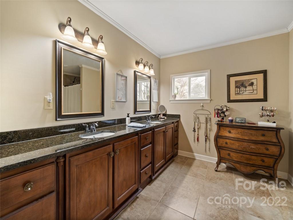 6758 Jenkins Road Morganton, NC 28655 - Photo 12 of 22 a spacious bathroom with a double vanity sink double and a mirror