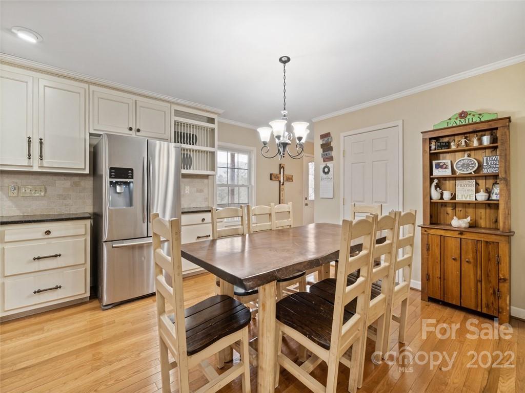 6758 Jenkins Road Morganton, NC 28655 - Photo 10 of 22 a kitchen with stainless steel appliances a refrigerator and a stove top oven