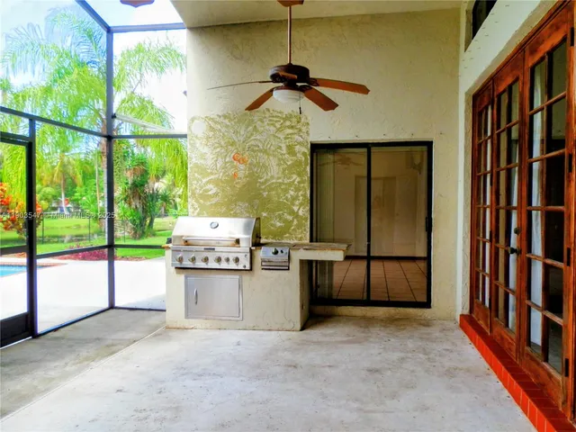 a view of a kitchen with a sink and a window