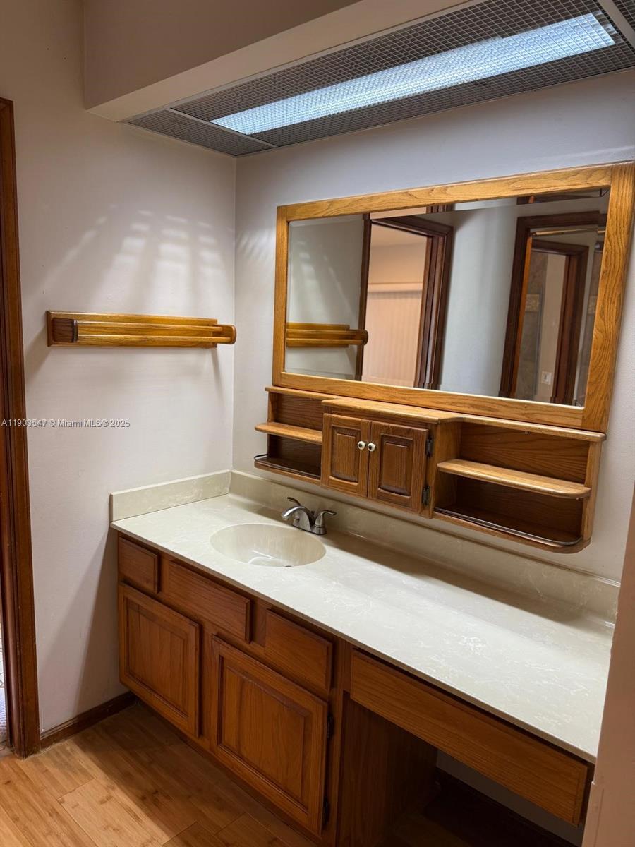 2700 Northwest 112th Avenue, Unit 2700 Coral Springs, FL 33065 - Photo 18 of 18 a bathroom with a sink and a mirror