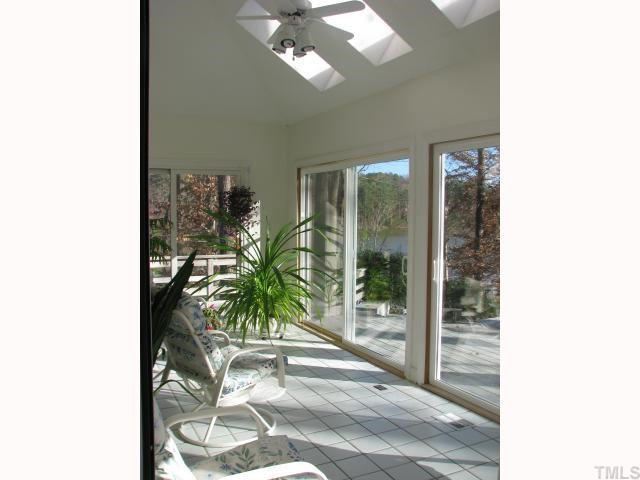 7301 Still Pond Court Raleigh, NC 27613 - Photo 6 of 12 This lovely room is accented with skylights, and glass on all three sides. Sun Room