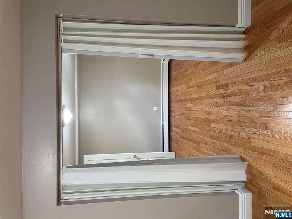 230 Anderson Avenue, Unit 1B Fairview, NJ 07022 - Photo 2 of 5 a view of empty room with wooden floor