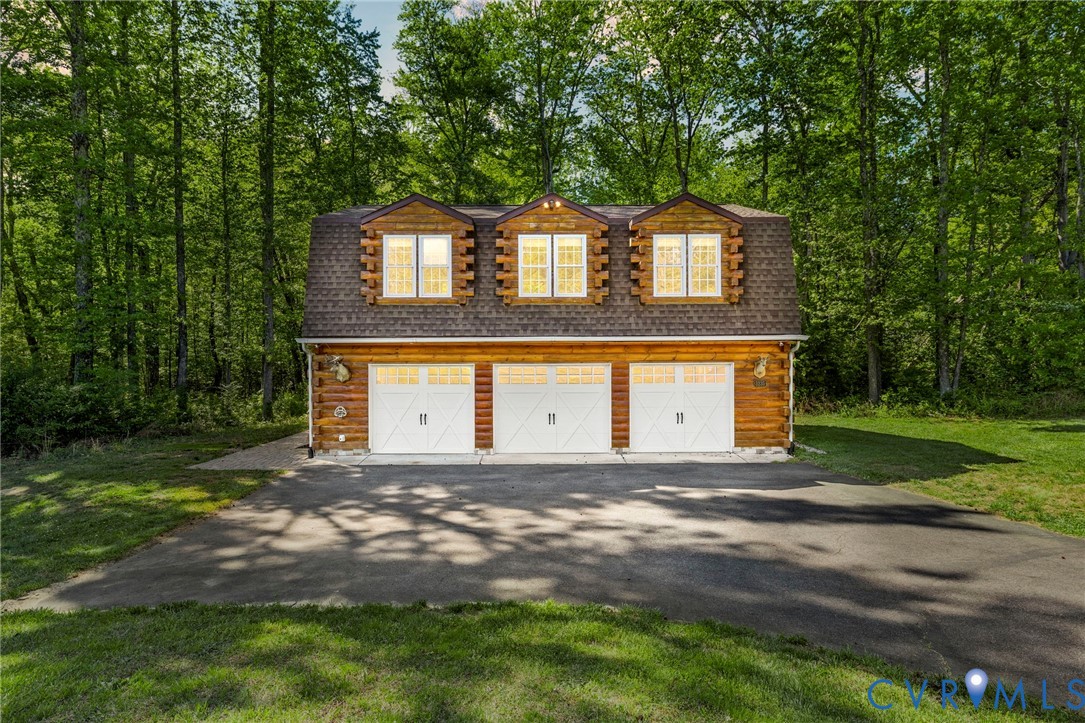 3235 Three Chopt Road Gum Spring, VA 23065 - Photo 1 of 33 a front view of a house with a yard and garage