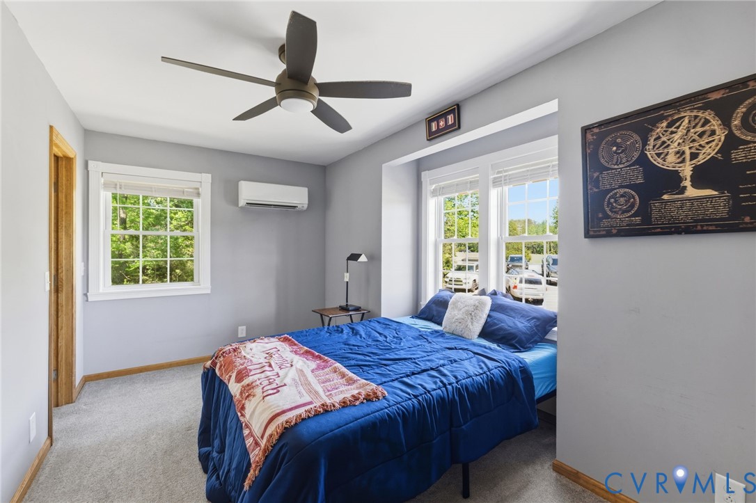 3235 Three Chopt Road Gum Spring, VA 23065 - Photo 16 of 33 a bedroom with a bed and a window