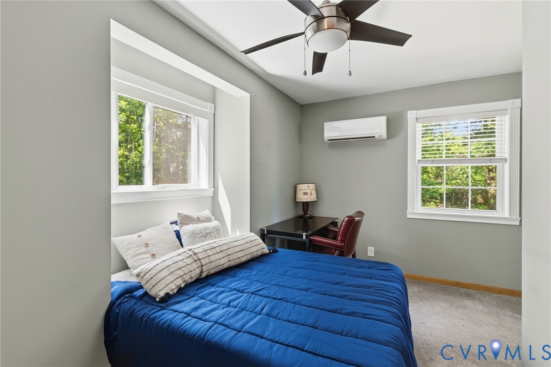 3235 Three Chopt Road Gum Spring, VA 23065 - Photo 19 of 33 a bedroom with a bed wooden floor and window