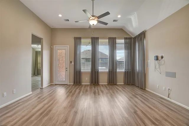 a view of livingroom with hardwood floor and a ceiling fan
