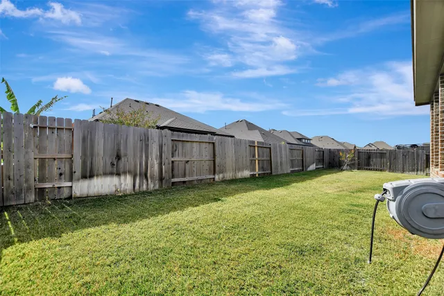 a view of a backyard with swimming pool
