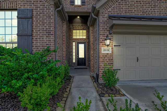 a view of a pathway besides a house