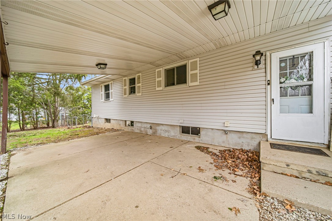 View of back covered patio that allows for outdoor protection from inclement weather.