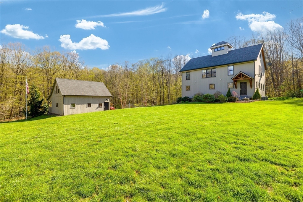 2120 Southbridge Road Warren, MA 01585 - Photo 1 of 1 a view of a house with a yard