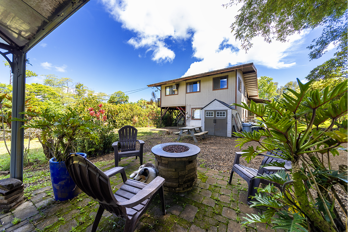 17-497 Homestead Road Kurtistown, HI 96760 - Photo 19 of 28 a view of a patio with furniture and a fire pit