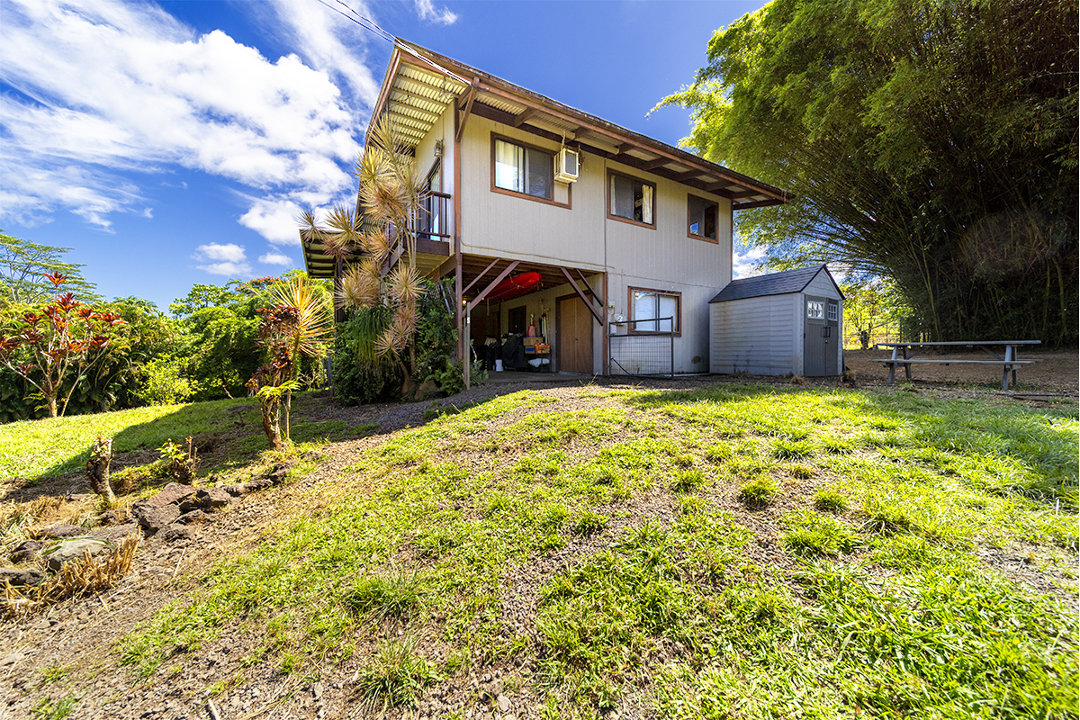 17-497 Homestead Road Kurtistown, HI 96760 - Photo 21 of 28 a view of a house with a yard
