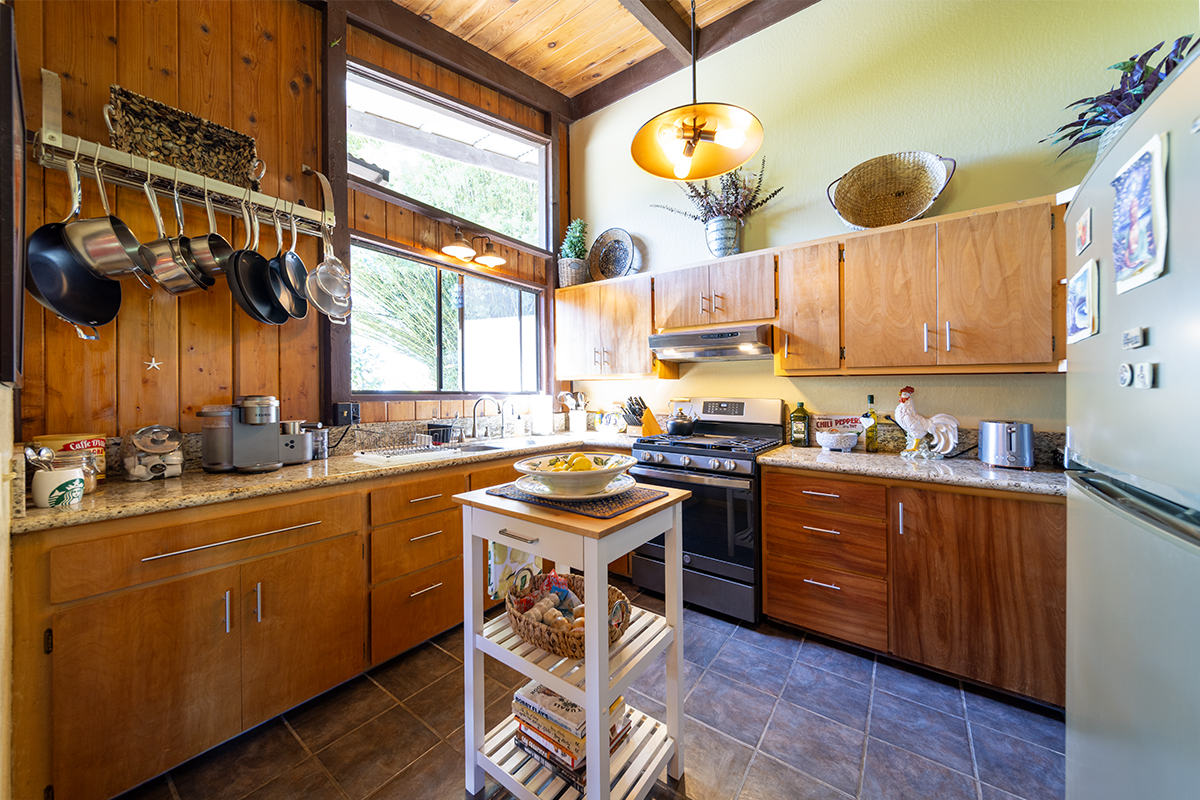 17-497 Homestead Road Kurtistown, HI 96760 - Photo 8 of 28 a kitchen with a sink and cabinets