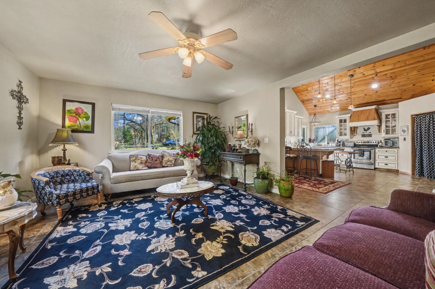 6145 Swiss Ranch Road Mountain Ranch, CA 95246 - Photo 19 of 84 a living room with furniture and a large window