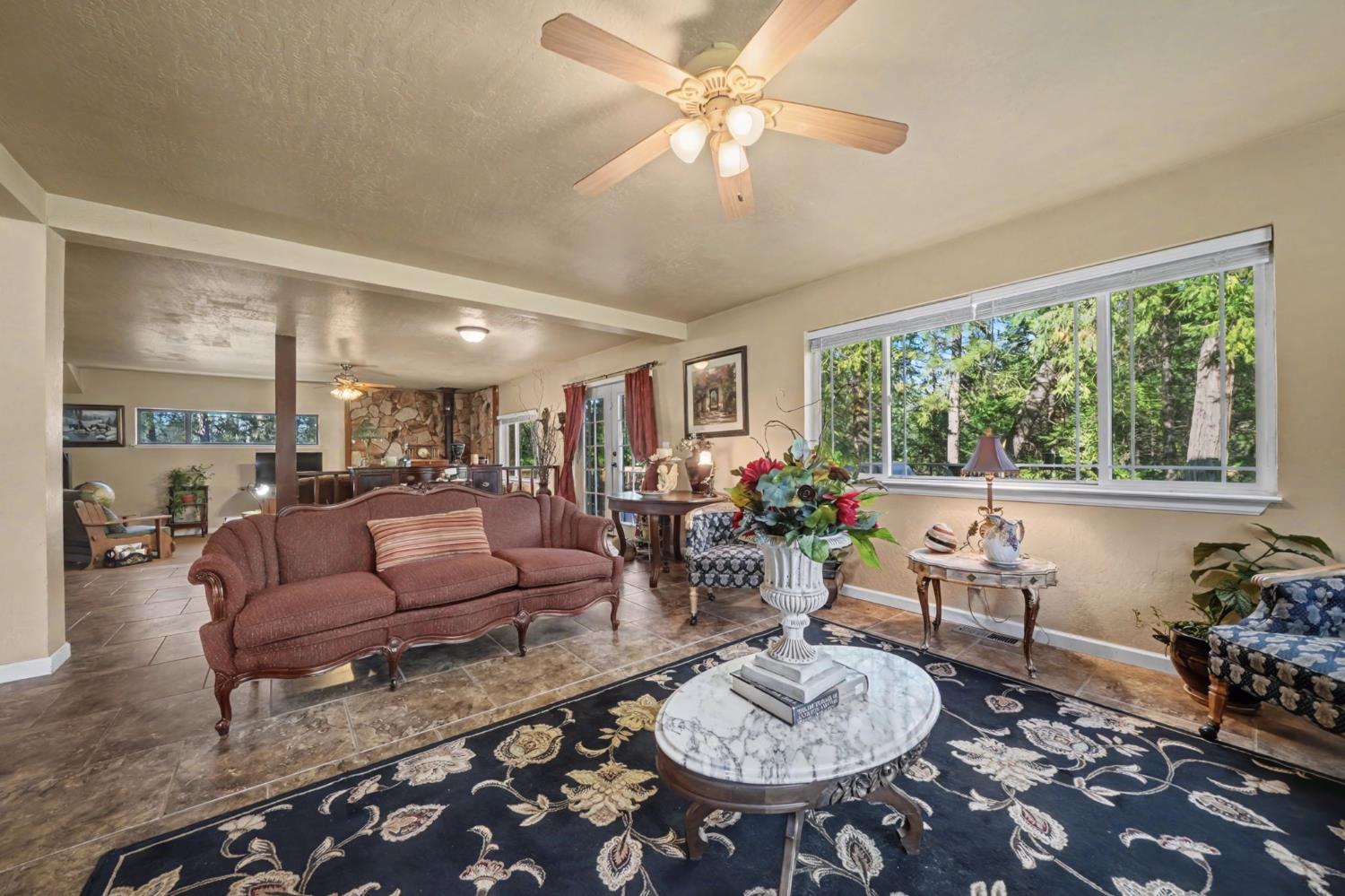 6145 Swiss Ranch Road Mountain Ranch, CA 95246 - Photo 21 of 84 a living room with furniture and a large window