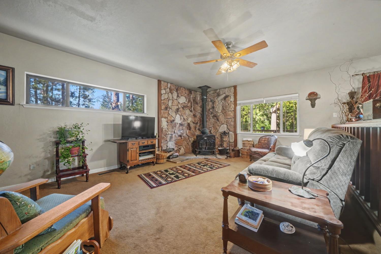 6145 Swiss Ranch Road Mountain Ranch, CA 95246 - Photo 27 of 84 a living room with furniture and a flat screen tv