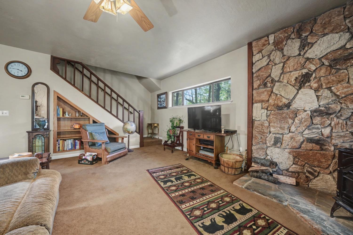 6145 Swiss Ranch Road Mountain Ranch, CA 95246 - Photo 29 of 84 a living room with furniture and a flat screen tv