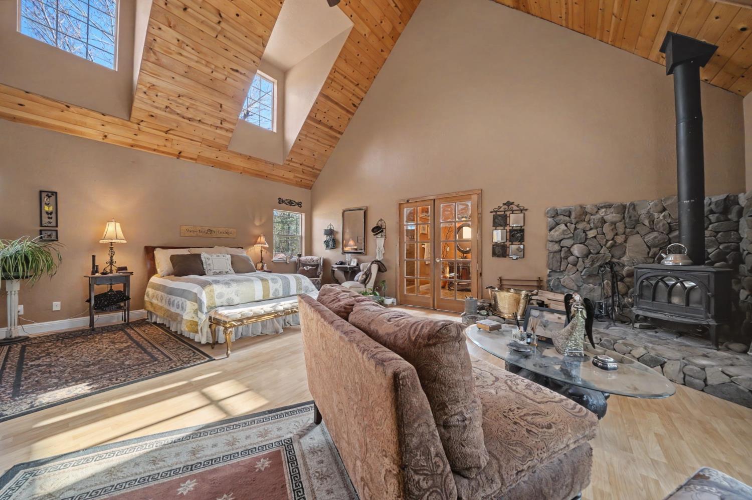 6145 Swiss Ranch Road Mountain Ranch, CA 95246 - Photo 35 of 84 a living room with furniture a large window and a rug