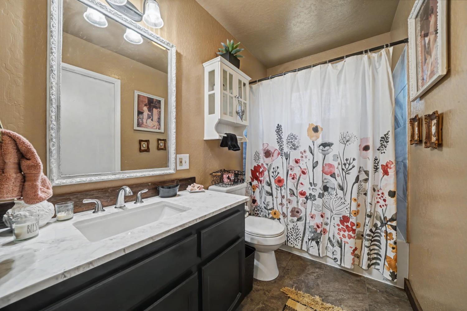 6145 Swiss Ranch Road Mountain Ranch, CA 95246 - Photo 48 of 84 a bathroom with a granite countertop sink and a mirror