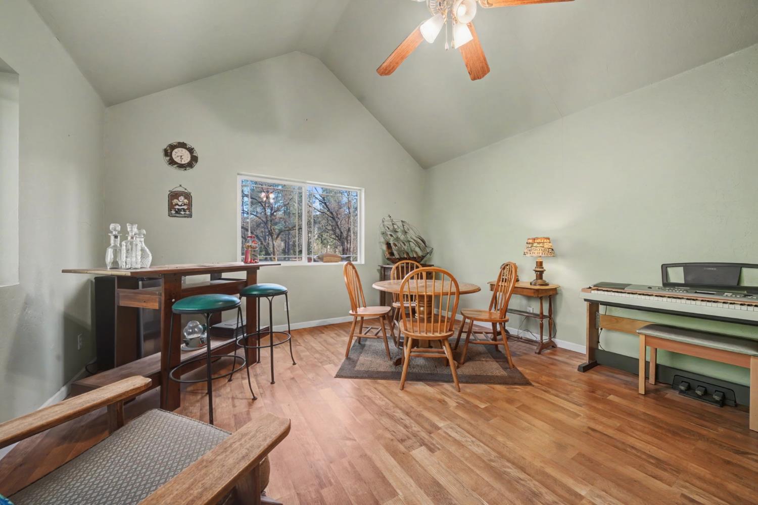 6145 Swiss Ranch Road Mountain Ranch, CA 95246 - Photo 52 of 84 a view of a dining room with furniture and wooden floor