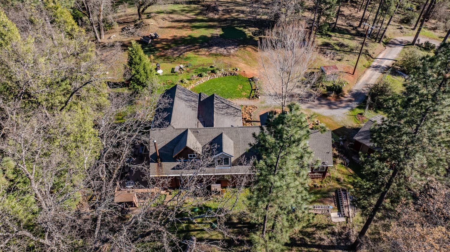 6145 Swiss Ranch Road Mountain Ranch, CA 95246 - Photo 73 of 84 an aerial view of a house with a yard and lake view