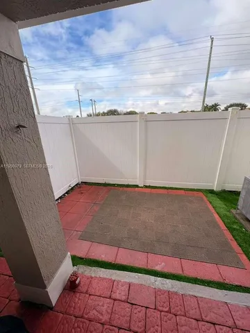 a view of swimming pool with a lounge chairs