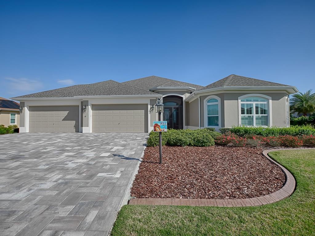 GORGEOUS CUSTOM FOUR BEDROOM PREMIER IN THE VILLAGE OF OSCEOLA HILLS AT SOARING EAGLE!