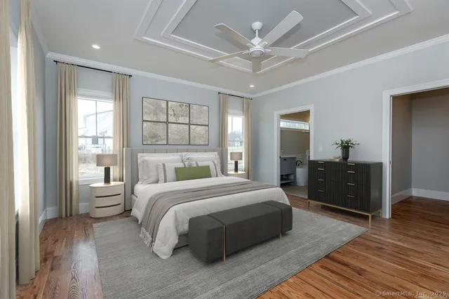 a bedroom with a large bed and a large window