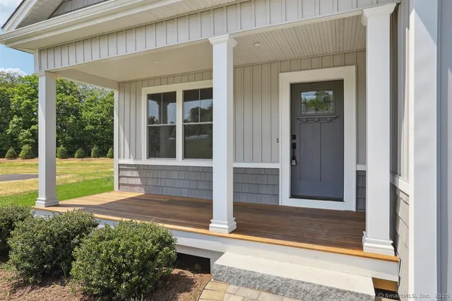 a view of house with backyard